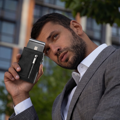 Man holding the Vault Wallet 2.0 outdoors